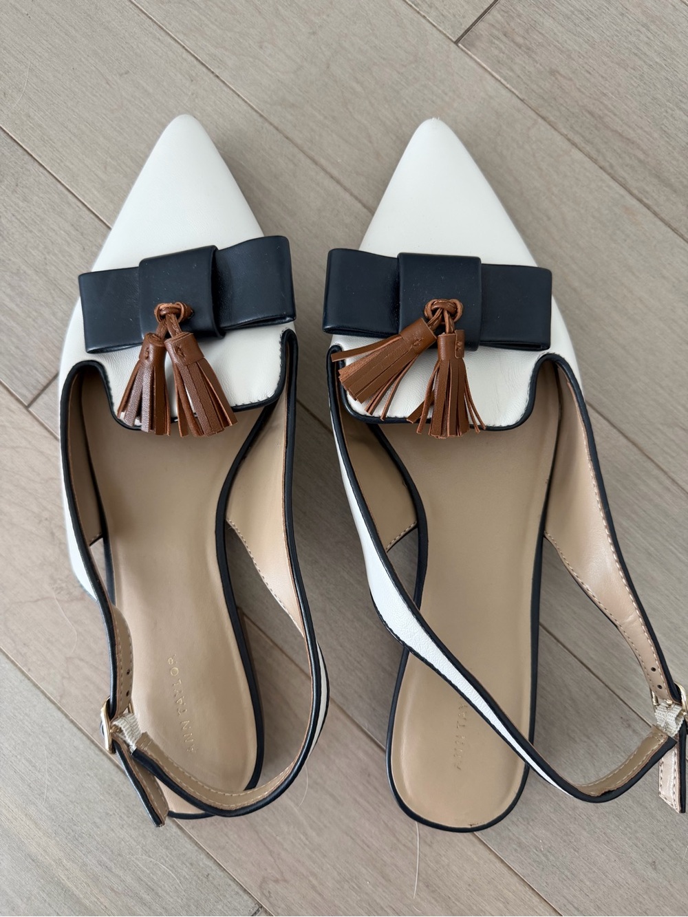 Pointed Toe White & Black Slingback Flats with Brown Tassel Accent